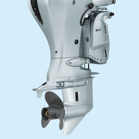 close up of the propeller system of a honda outboard engine