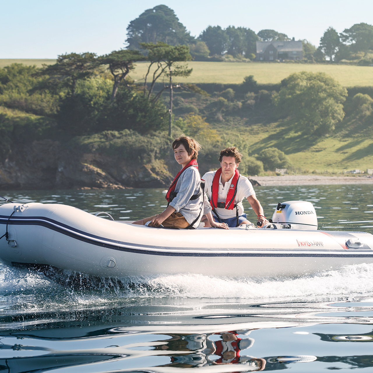 Boat in water with sceneic greenery in background