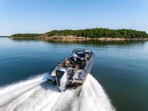 Models in the back of the boat in sea location featuring BF350 engine.