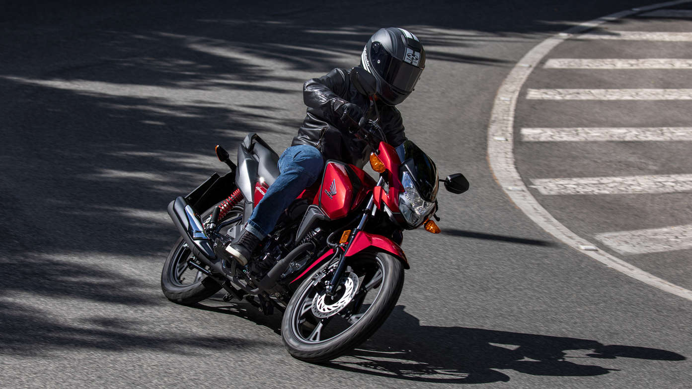 Honda CB125F being ridden on the road