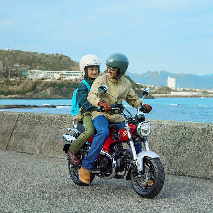 Honda Dax 125 with coastal backdrop