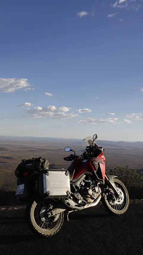 Honda CRF1000L Africa Twin parked on the roadside overlooking the Karoo desert.