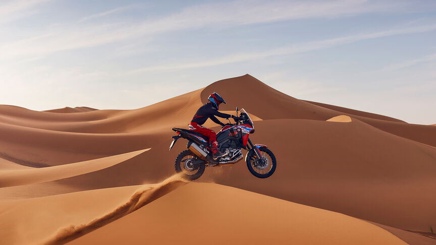 Africa Twin Off-road with rider on sand dune