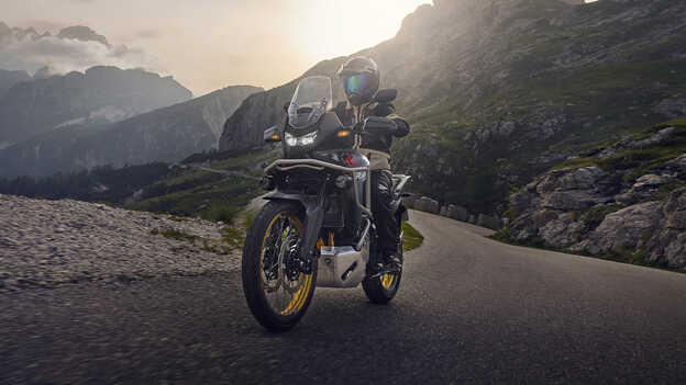 Dax 125 static rear three quarter image by the sea.