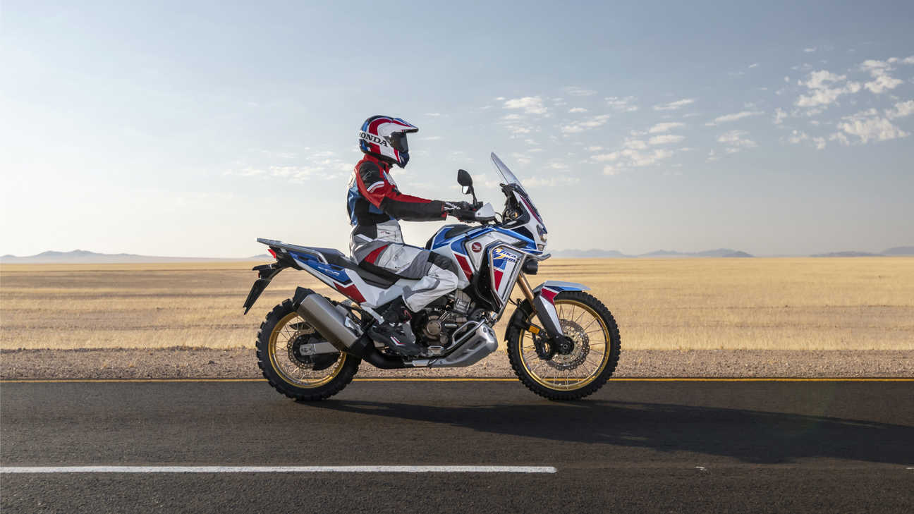 Honda Africa Twin Adventure Sports, riding on road through desert landscape