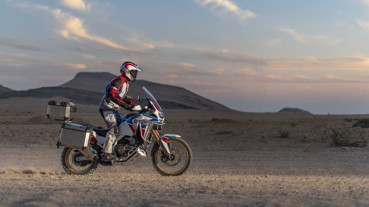 Honda Africa Twin Adventure Sports, right side, riding on dirt road in desert landscape