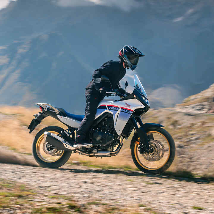 XL750 Transalp side on dynamic shot with rider