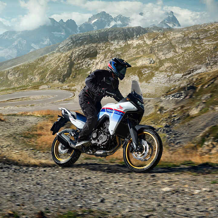 Honda XL750 Transalp rider on mountain pass