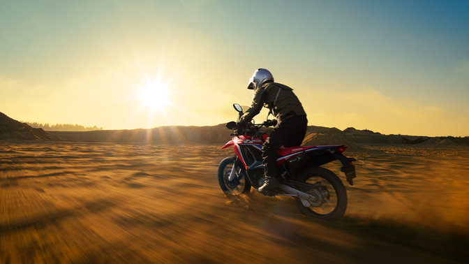 CRF250 Rally three quarter left side with rider
