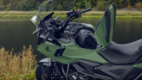 Side view of the Honda NC750X motorcycle 23l storage space.