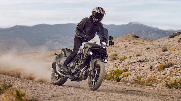 Honda NX500 being ridden on gravel track