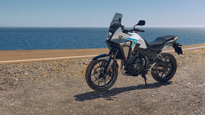 Honda NX500 side shot off road next to coast