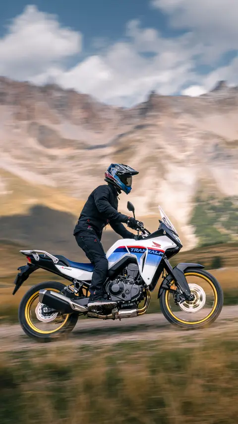 Rider on XL750 Transalp in mountain location.