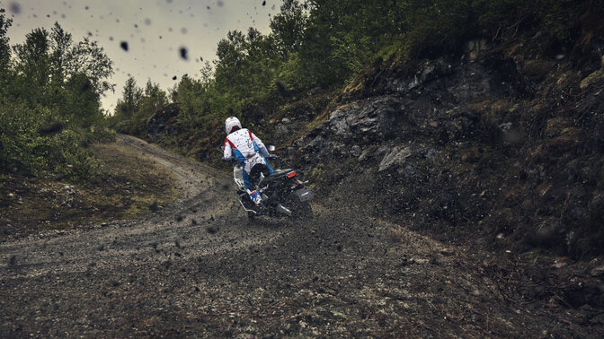 X-ADV taking a turn on a dirt road