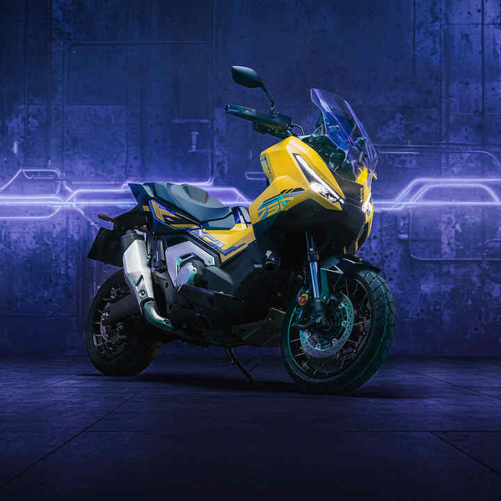 X-ADV special edition side on shot with rider in urban area