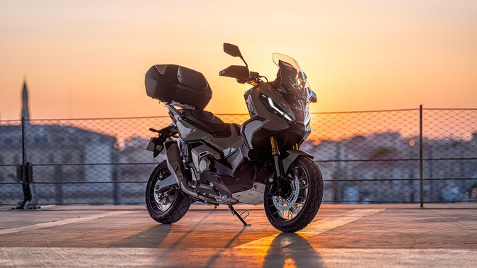 Honda X-ADV, 3-quarter front right side, parked on parking, sunset