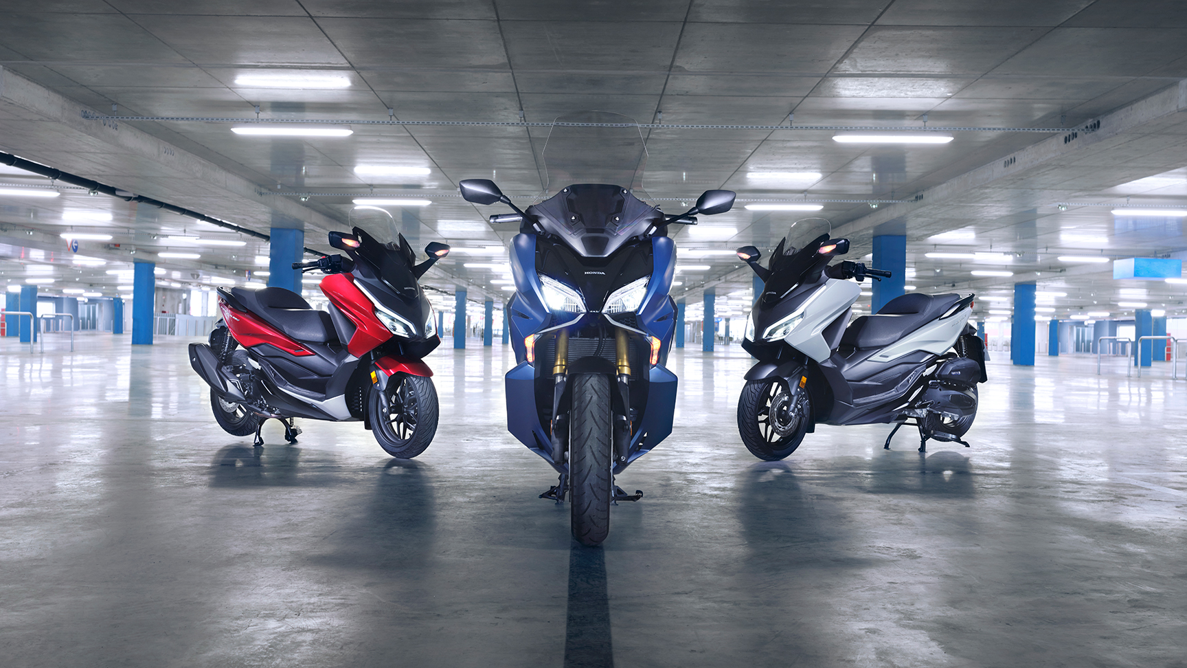 Honda Forza family in car park