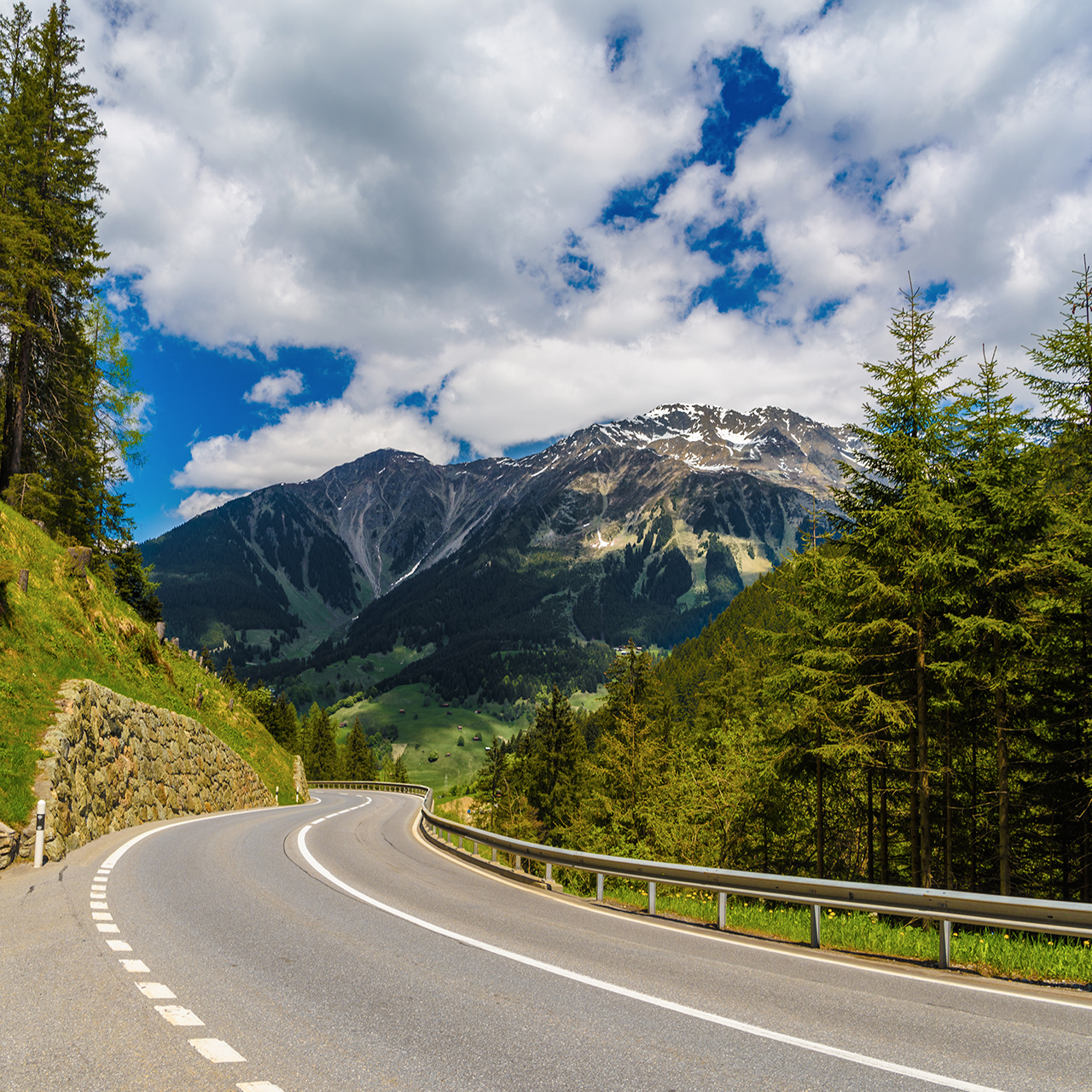 Road among Alps mountains, Klosters-Serneus, Davos, Graubuenden Switzerland