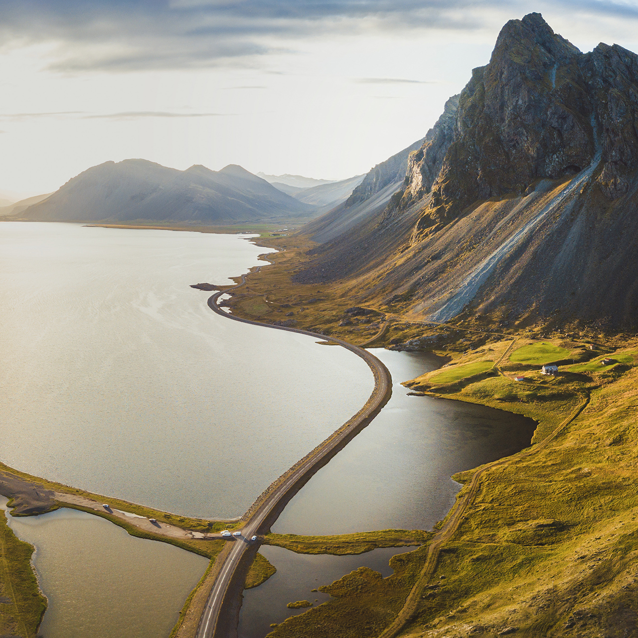 Scenic road in Iceland, beautiful nature landscape aerial panorama, mountains and coast at sunset