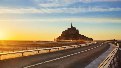 Road to Mont Saint Michel at sunset, Normandy. France.