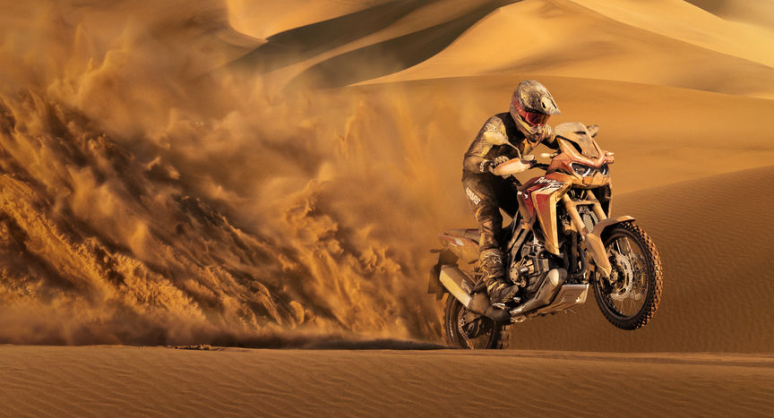 Honda Africa Twin, 3-quarter front right side, riding in sand