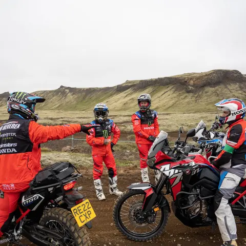 Experts explaining to a group of riders. 