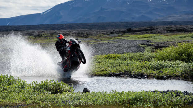 Kiran Mirabet riding Africa Twin through water. 