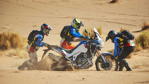 Africa Twin motorcycle pushed to the limit in tough terrain.