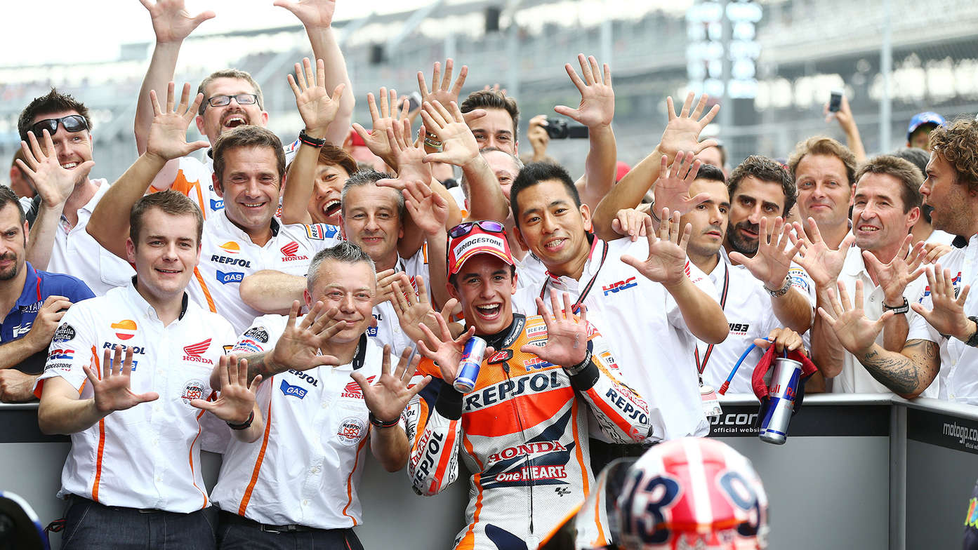 Marc Marquez riding a Honda motorcycle.