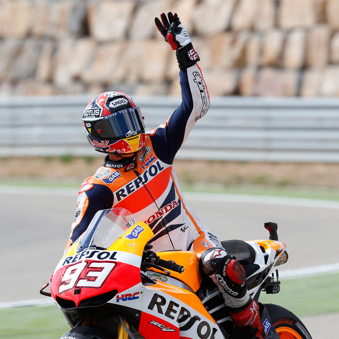 Honda MotoGP racer crossing the finish line.