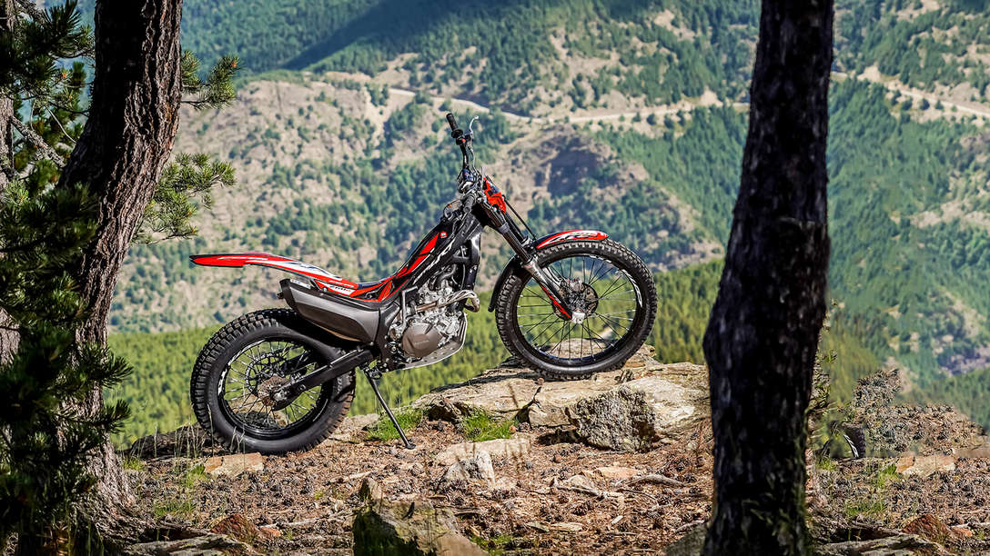 Side facing Honda Montesa Cota 4RT 260R in forest location.
