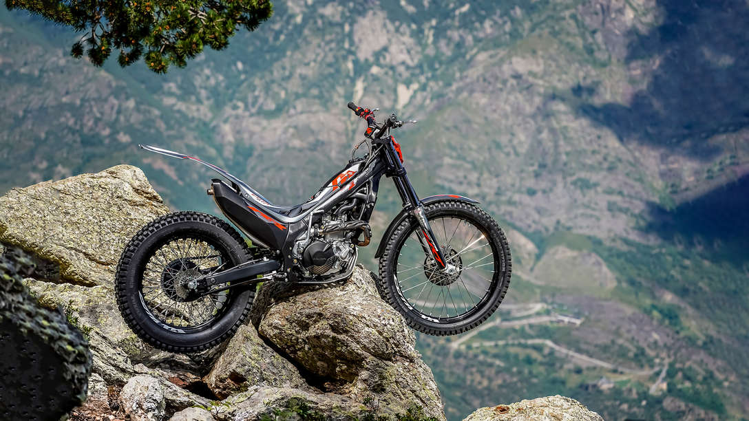 Side facing Honda Montesa Cota 4RT 301RR on a rock, right side view.