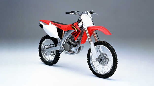 Side facing 2002 Honda CRF450R in the studio.