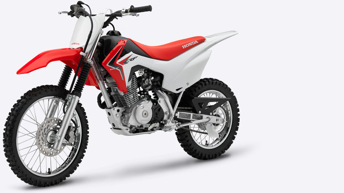 Side, 3-quarter view of red CRF125F, left facing.
