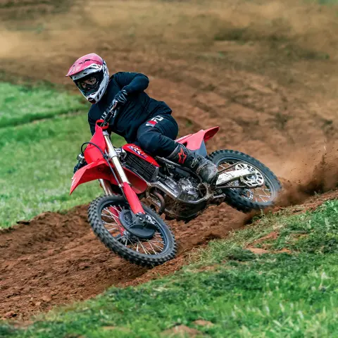 Honda CRF250R dynamic image on track with MX rider