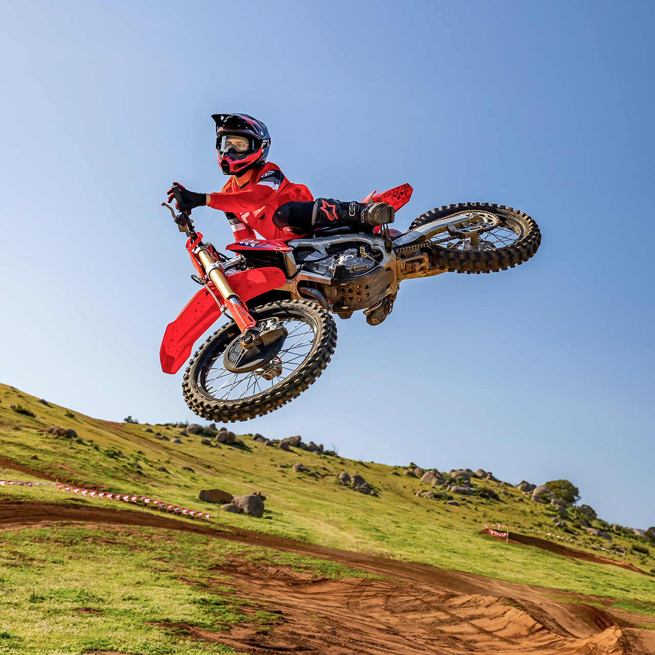 CRF450R on track with motorcross rider