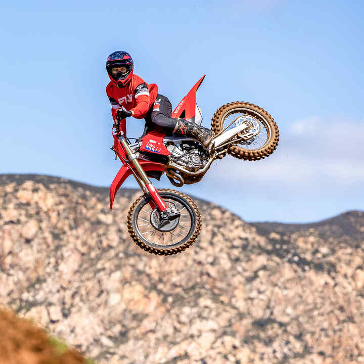 CRF450R on track shot with MX rider