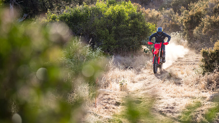 Honda CRF450RX on an off road trail.