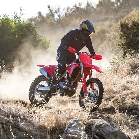 Honda CRF450RX being ridden on an off road track.