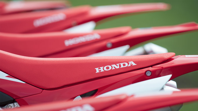 close up of the tails of a range of honda off road motorcycles