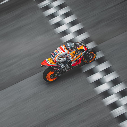 Honda MotoGP rider crossing the finish line.