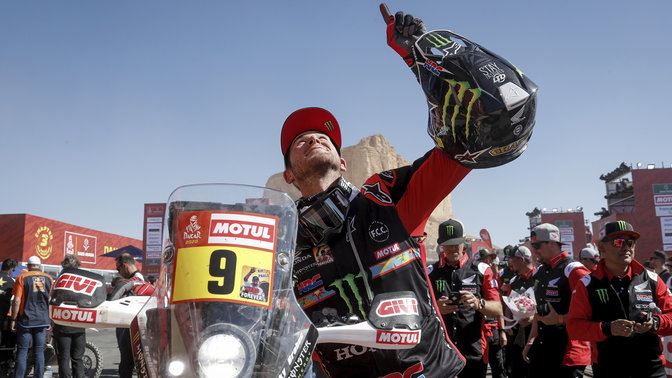 Honda Rally rider celebrating victory.