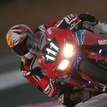 Close up of Honda EWC motorcycle on the race track.