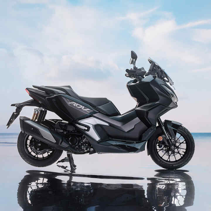 Side view of Honda ADV350 in coastal location. 