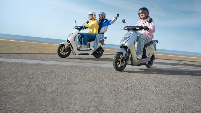 Honda EM1 e: on the road with two riders and pillion