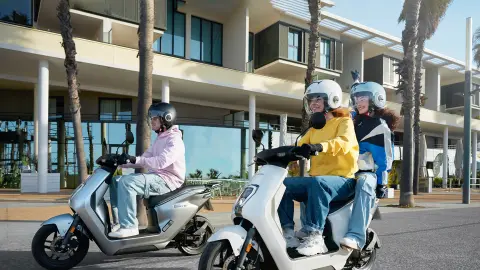 Honda EM1 e: in grey and white colour options with riders on road