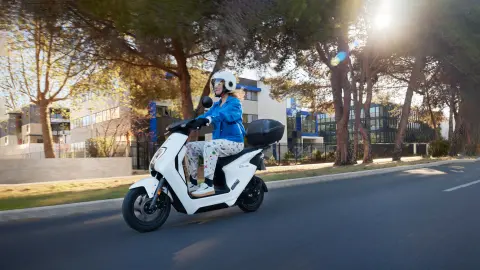 Honda EM1 e: in white with top box on road