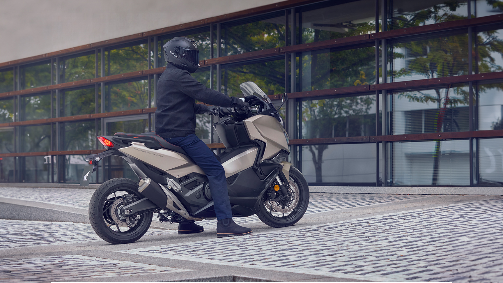 Forza 750 motorcycle parked in a street location.