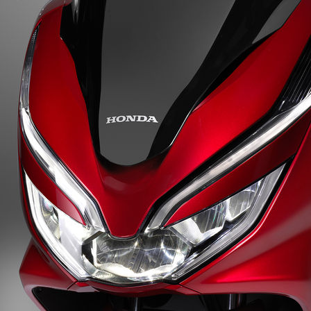 Close up of headlights on Honda PCX125.