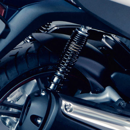 Close up of Honda SH300i rear suspension.